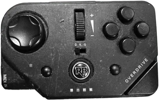 A MIDI PRO Adapter with the middle switch set to 'D'.