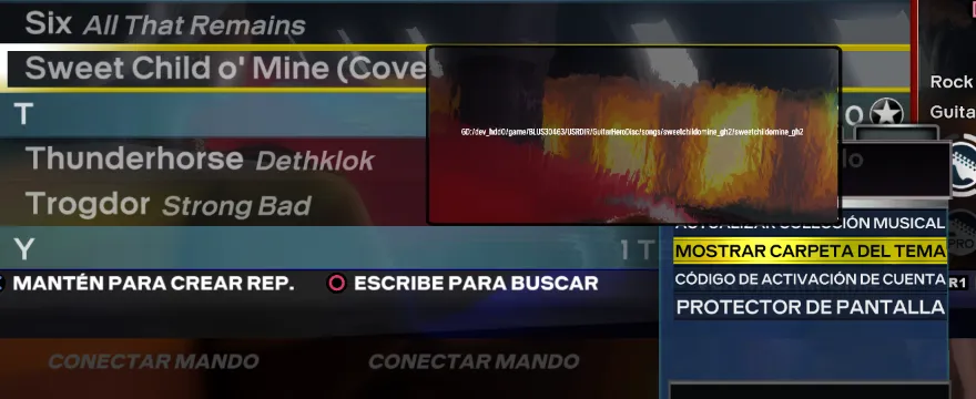 Rock Band 3 Deluxe con una canción resaltada y 'Mostrar carpeta del tema' elegida en el menú. Salio una pantalla que contiene la dirección de la canción.