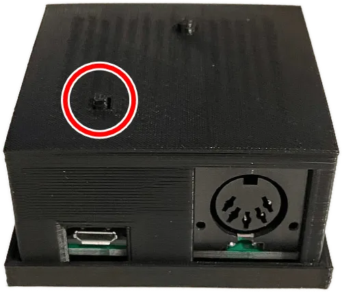 A Roll Limitless adapter, showing the firmware button circled in red.